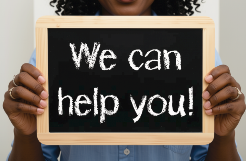 Woman holding a sign that says we can help you